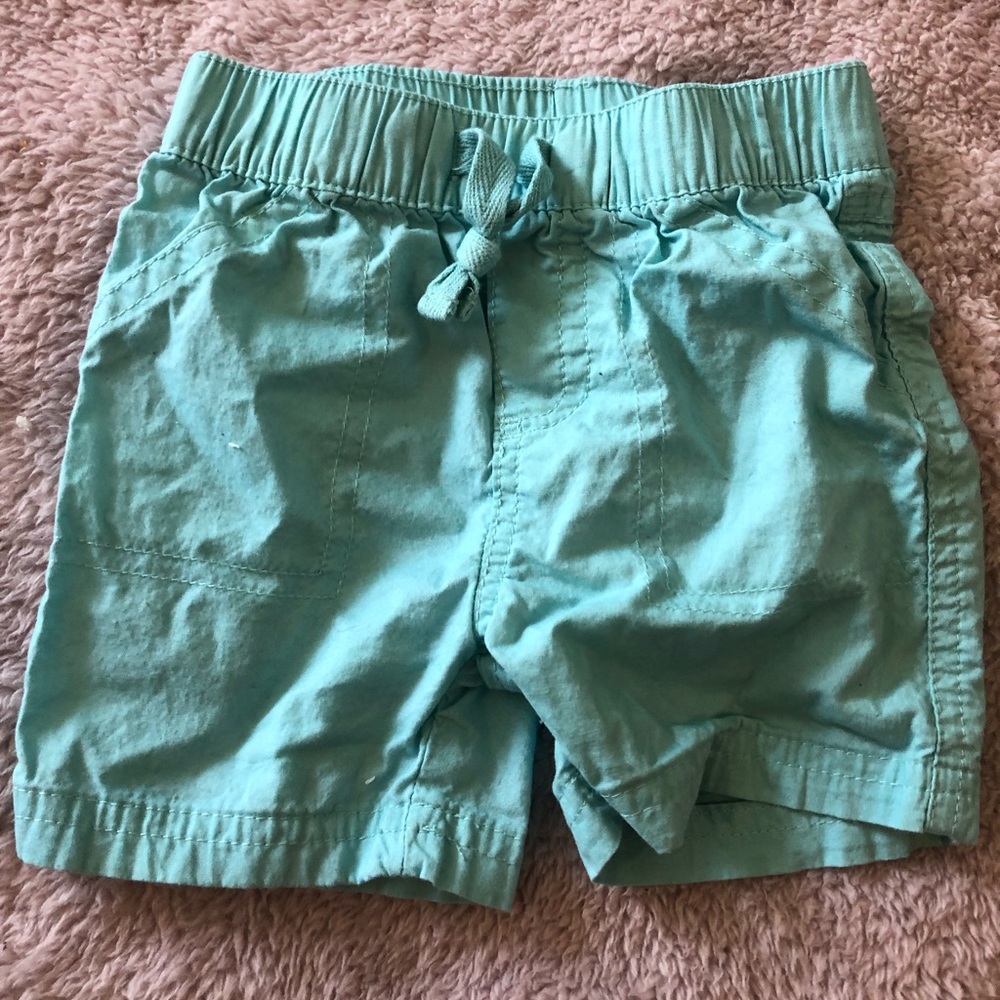 Teal shorts.